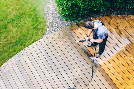 Pressure washing a deck full of mold